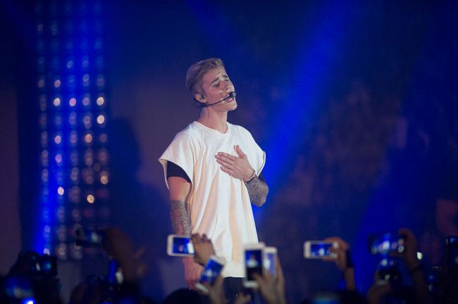 HONG KONG - JUNE 11: Justin Bieber performs at the Calvin Klein Jeans music event in Hong Kong with special appearance from Justin Bieber and performances by Jay Park, Kevin Poon, Joon & Verbal at the Kai Tak Cruise Terminal, Hong Kong, Thursday, June 11, 2015.