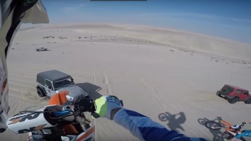 Dirt Bike Bro Smashes Into The Hood Of A Jeep Wrangler After Nailing A Sick Jump