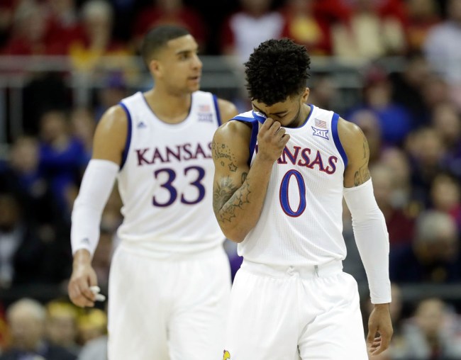 KANSAS CITY, MO - MARCH 09:  Frank Mason III #0 and Landen Lucas #33 of the Kansas Jayhawks walk off the court during a timeout in the quarterfinal game of the Big 12 Basketball Tournament against the TCU Horned Frogs at the Sprint Center on March 9, 2017 in Kansas City, Missouri.  (Photo by Jamie Squire/Getty Images)