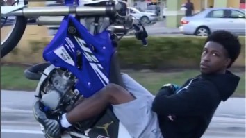 Someone Tell Me How This Dude Popping Wheelies Weaving Through Traffic Is Still Alive.