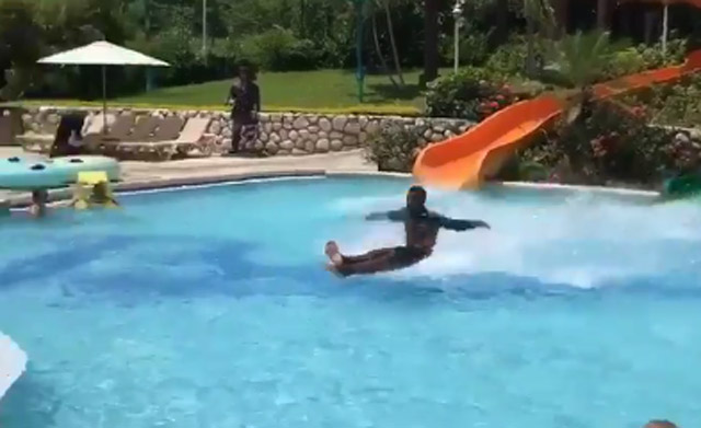 guy exits water slide glides