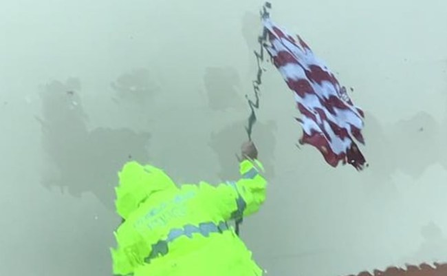 Texas Police Officer Saves American Flag During Hurricane Harvey