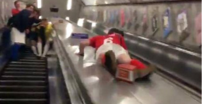 drunk soccer fan escalator