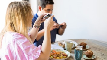 New Study Finds That An Insane Percentage Of Americans Can’t Eat Without Their Phones