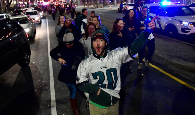 After city officials grease light poles to prevent climbing, Phillies fans  scale them anyways