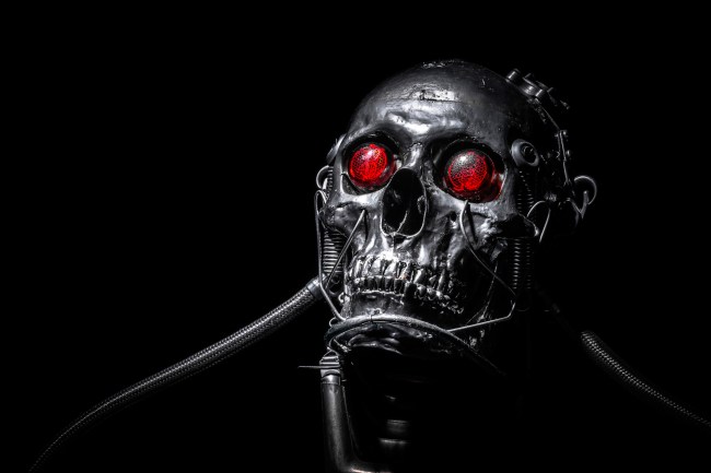 Skull of a human size robot isolated on black