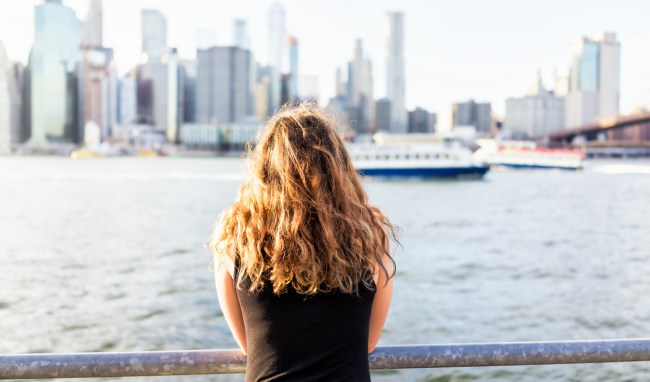 woman looking at new york city skyline