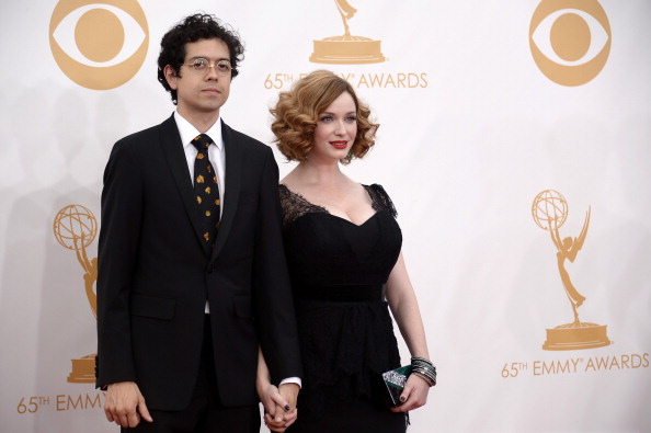  Actress Christina Hendricks (R) and husband Geoffrey Arend arrives at the 65th Annual Primetime Emmy Awards held at Nokia Theatre L.A. Live on September 22, 2013 in Los Angeles, California.  (Photo by Kevork Djansezian/Getty Images)