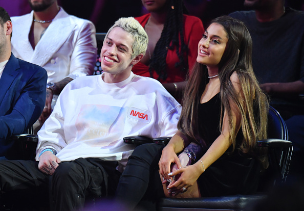 Pete Davidson (C) and Ariana Grande (R) attend the 2018 MTV Video Music Awards at Radio City Music Hall on August 20, 2018 in New York City.  (Photo by Jeff Kravitz/FilmMagic)