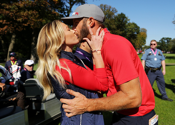 CHASKA, MN - SEPTEMBER 30: Paulina Gretzky kisses Dustin Johnson of the United States after the end of the round during morning foursome matches of the 2016 Ryder Cup at Hazeltine National Golf Club on September 30, 2016 in Chaska, Minnesota.  (Photo by Streeter Lecka/Getty Images)
