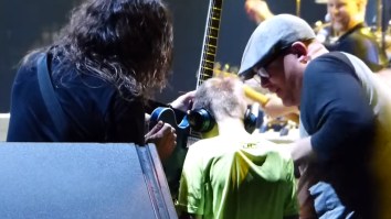 Amazing Moment Dave Grohl Brings Blind Autistic 10-Year-Old Boy To Play Guitar During Foo Fighters Concert