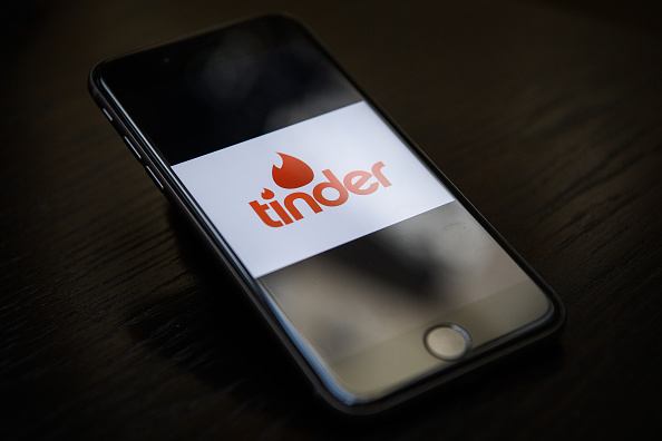 LONDON, ENGLAND - NOVEMBER 24:  The "Tinder" app logo is seen on a mobile phone screen on November 24, 2016 in London, England.  Following a number of deaths linked to the use of anonymous online dating apps, the police have warned users to be aware of the risks involved, following the growth in the scale of violence and sexual assaults linked to their use.  (Photo by Leon Neal/Getty Images)