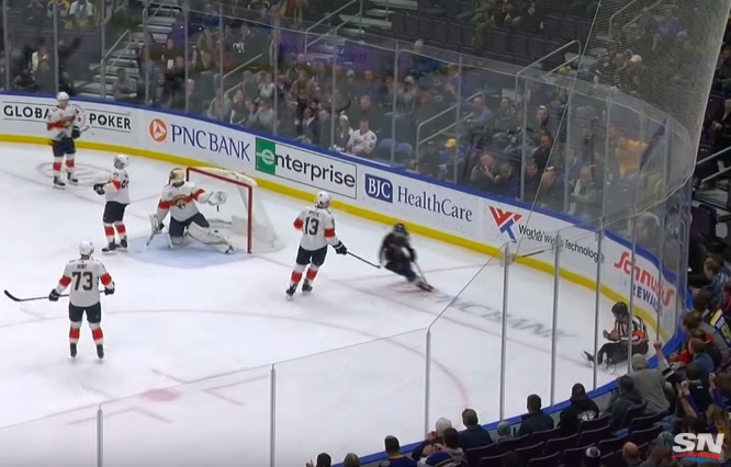 NHL referee crumbles to the ice after a puck deflects off his groin and  into the net