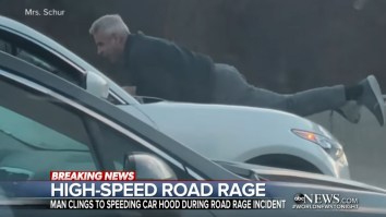 Man Clings To The Hood Of SUV Going 70 MPH In One Of The Wildest Road Rage Incidents You’ll Ever See
