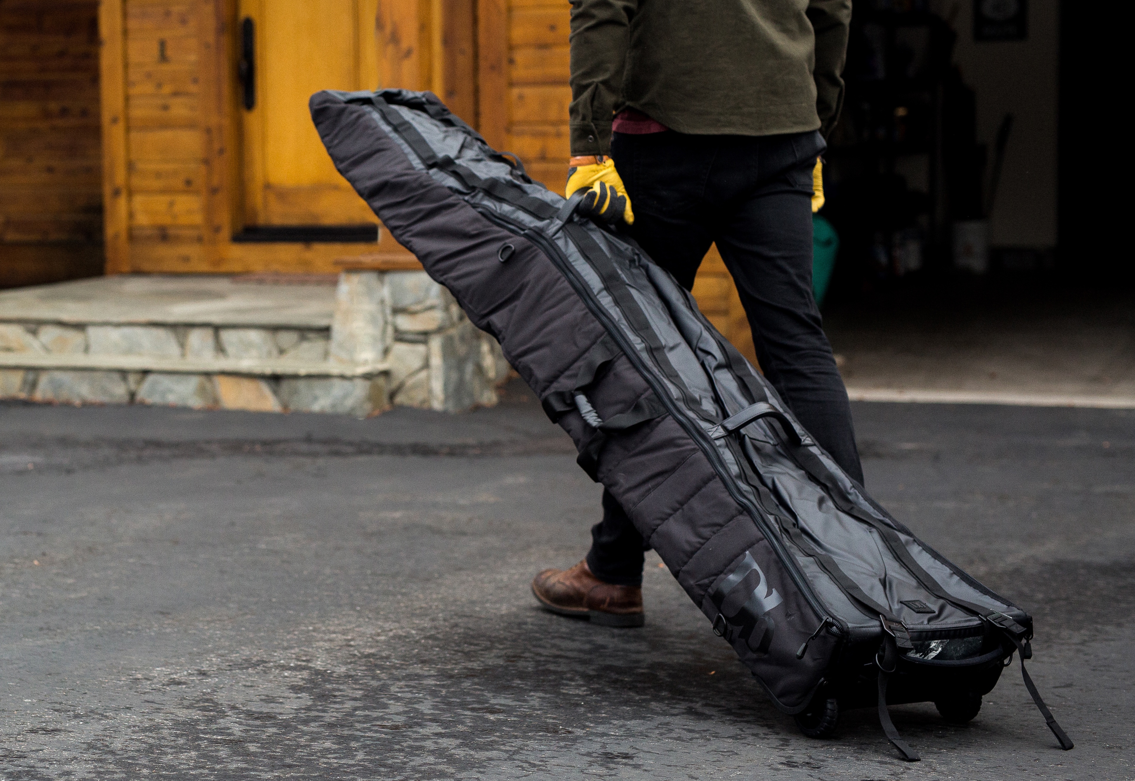 The Amazing 'Snow Roller' Ski And Snowboard Bag Rolls Up To The 
