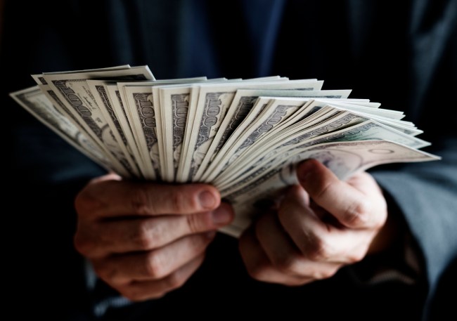 Closeup of hands holding cash