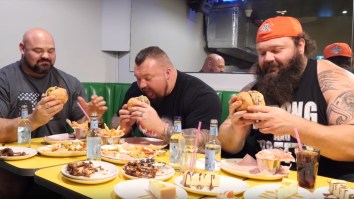 World’s Strongest Men Do 20,000 Calorie Challenge, Squeeze Into Tiny Economy Airplane Seats Together In Hilarious Photo