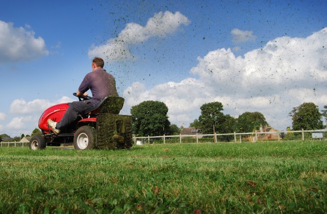 Man mowing the grass on a riding mower