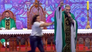 Woman Viciously Shoves Anti-Gay Priest Off The Stage While Delivering Sermon In Front Of 50,000 People