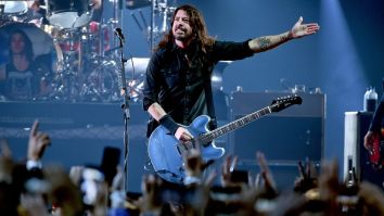 Watch Dave Grohl Invite A Foo Fighters Fan In Wheelchair To Crowdsurf Onto The Stage And Throw A Guitar