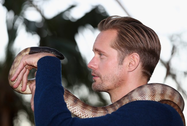 Alexander Skarsgard Tarzan holding snake