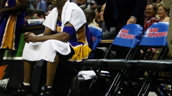 Kobe Bryant Looks Like He’s Being Held Hostage In This Photo Of His Daughter’s Basketball Team Posing With 4th Place Trophies