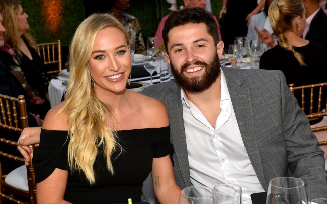 baker mayfield and his wife emily posing for a photo