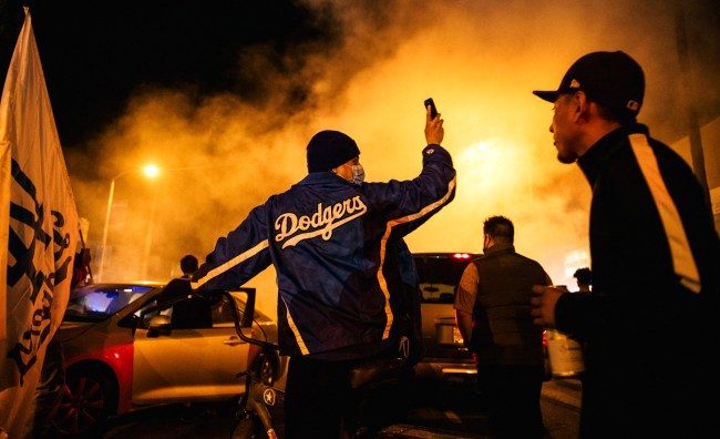 Car Clips Cyclist Fire Looting Arrests During Dodgers Celebration