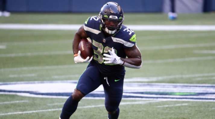 Chris Carson better start sleeping with the football in his hands