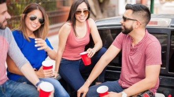 Friends And Family Enjoy Full-Scale Tailgate Party At Hospital Parking Lot Waiting For Birth Of Baby