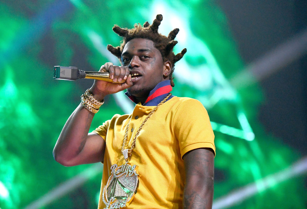 Kodak Black Under Attack For Posing Next to a Purple and Gold Helicopter