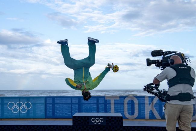 Tokyo 202 Brazil's Italo Ferreira, Gold medalist, celebrates on the podium at the Tsurigasaki Surfing Beach, in Chiba, on July 27, 2021 during the Tokyo 2020 Olympic Games. (Photo by Olivier MORIN / AFP) (Photo by OLIVIER MORIN/AFP via Getty Images)