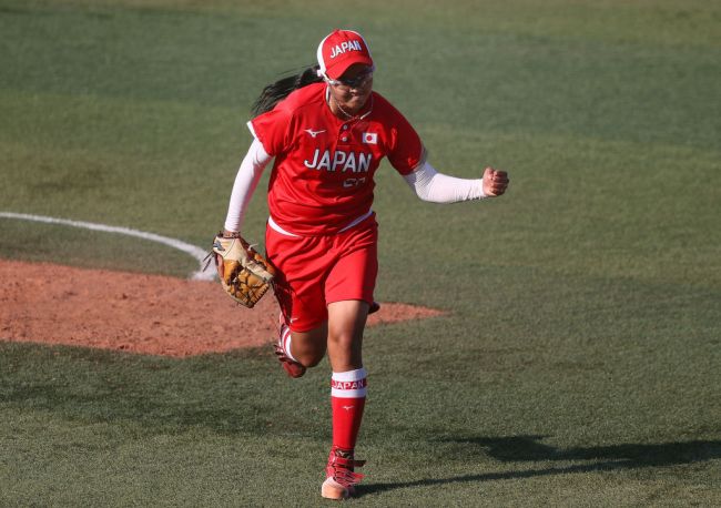 YOKOHAMA, JAPAN - JULY 25: Pitcher Miu Goto #27 of Team Japan pumps her fist after getting out of the top of the eighth inning against Team Canada during the Softball Opening Round on day two of the Tokyo 2020 Olympic Games at Yokohama Baseball Stadium on July 25, 2021 in Yokohama, Kanagawa, Japan. Team Japan defeated Team Canada 1-0.