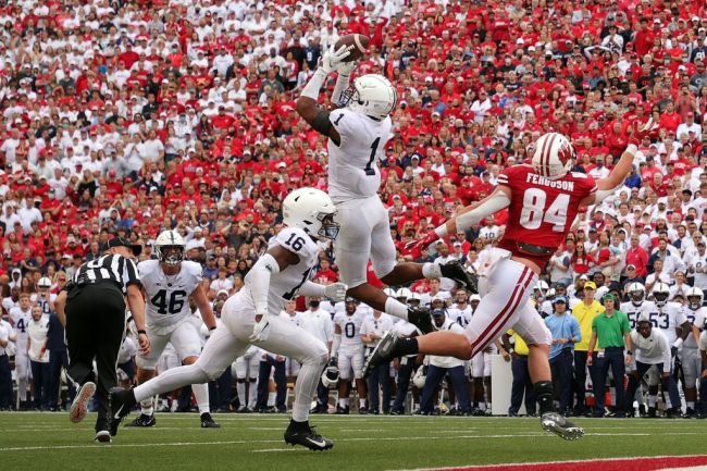 MADISON, WISCONSIN - SEPTEMBER 04: Jaquan Brisker #1 of the Penn State Nittany Lions intercepts a pass intended for Jake Ferguson #84 of the Wisconsin Badgers during the second half at Camp Randall Stadium on September 04, 2021 in Madison, Wisconsin via Getty Images