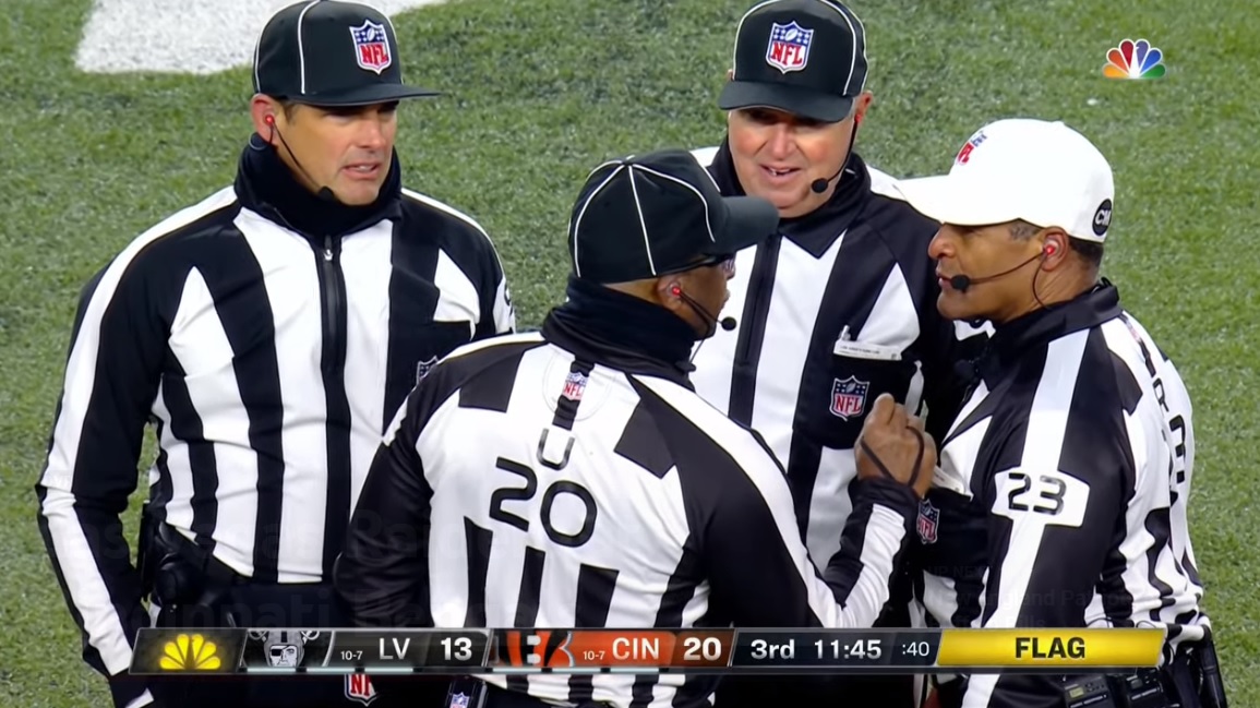 NFL referee Jerome Boger (23) watches a replay during the second half of an  NFL football game between the Minnesota Vikings and the Washington  Commanders, Sunday, Nov. 6, 2022, in Landover, Md. (