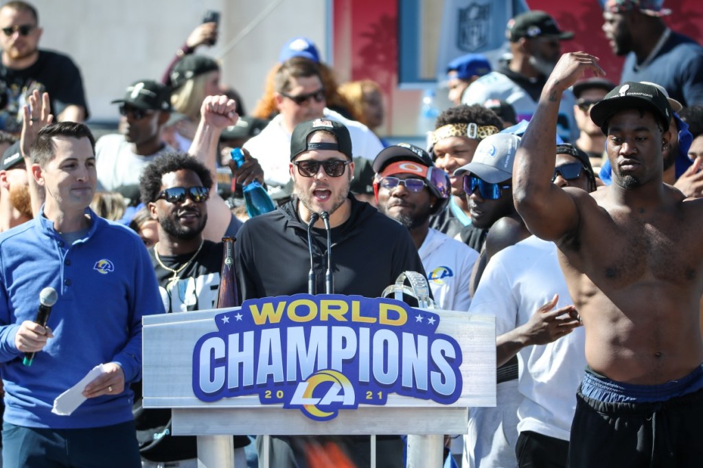 Matthew Stafford turns away as Rams parade photographer falls