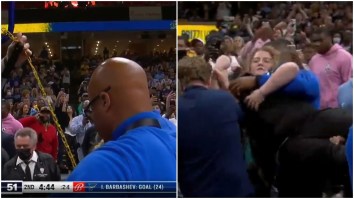 Unruly Fan Forcibly Carried Out Of The Arena By Security After She Chained Herself To Back Of Basket During Grizzlies-Timberwolves Playoff Game