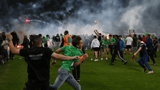 Utter Mayhem Unfolds After French Soccer Fans Storm Pitch, Throw Flares At Players Over Relegation Loss
