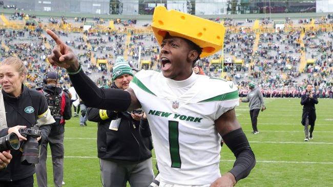 Jets' Sauce Gardner wearing a packers cheesehead
