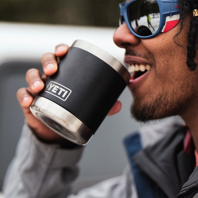 Man pictured enjoying a beverage out of his YETI Lowball cup