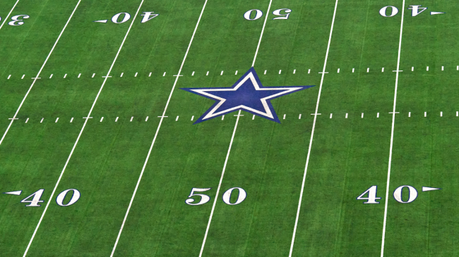 The Dallas Cowboys logo sits at midfield.
