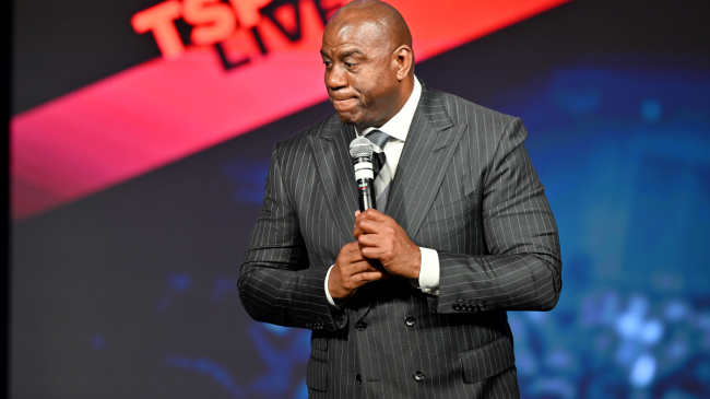 Magic Johnson speaks at an event.