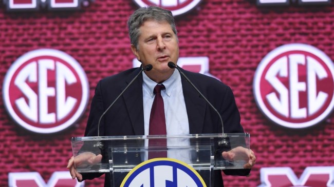 mike leach speaking at a podium during an SEC press conference