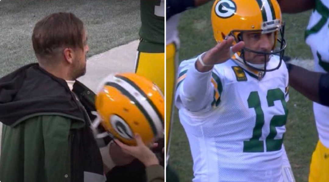 Aaron Rodgers salutes the crowd