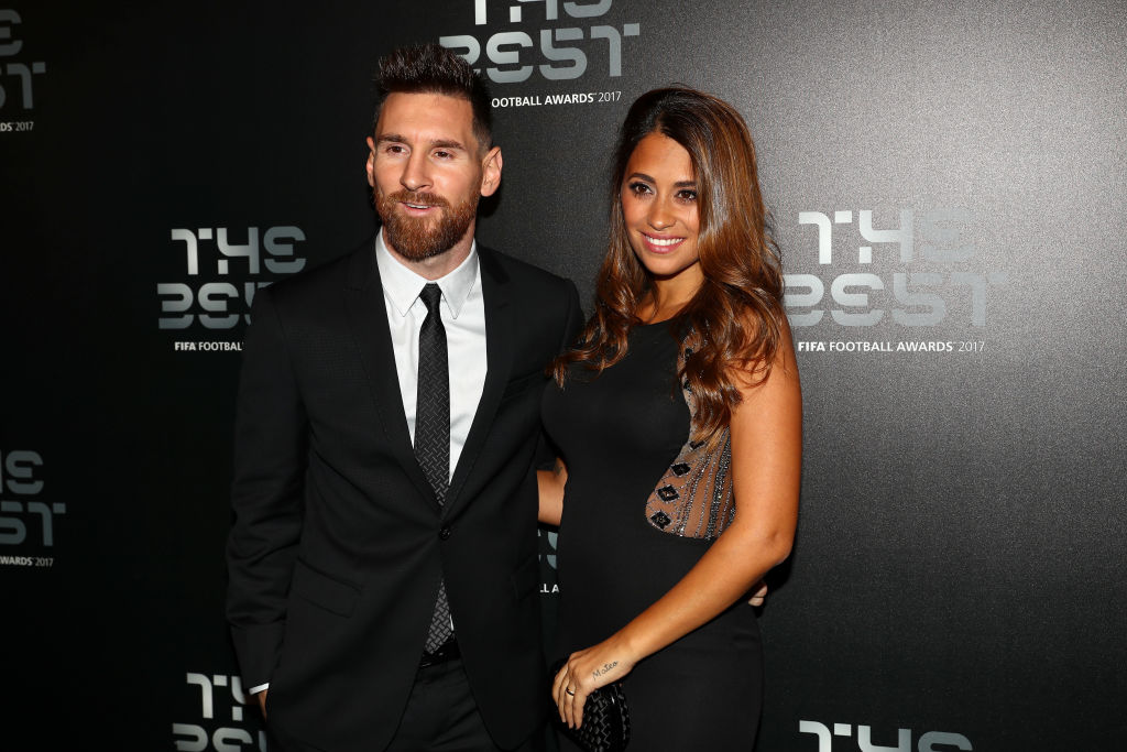 Messi and wife posing for camera