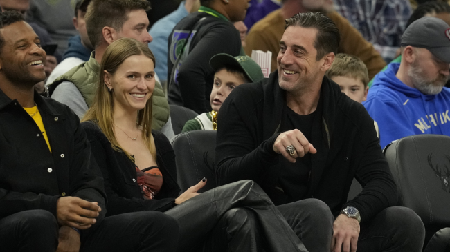Aaron Rodgers sits courtside at a Bucks game.