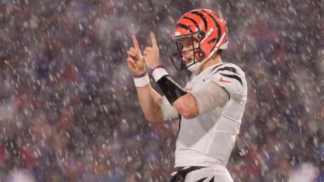 joe burrow in the snow pointing his fingers