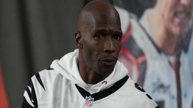 Chad Johnson walks the sidelines at a Bengals game.