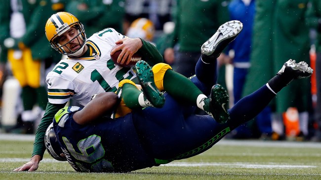 Cliff Avril tackles Aaron Rodgers during the NFC Championship game in 2015