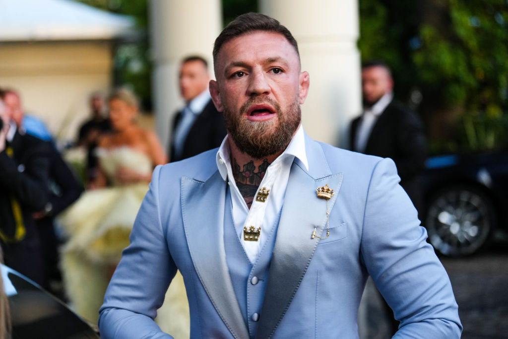 Conor McGregor walking in a suit